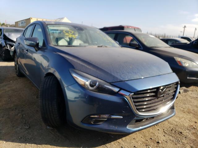 2018 mazda 3 grand to