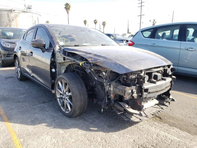 2018 mazda 3 grand to