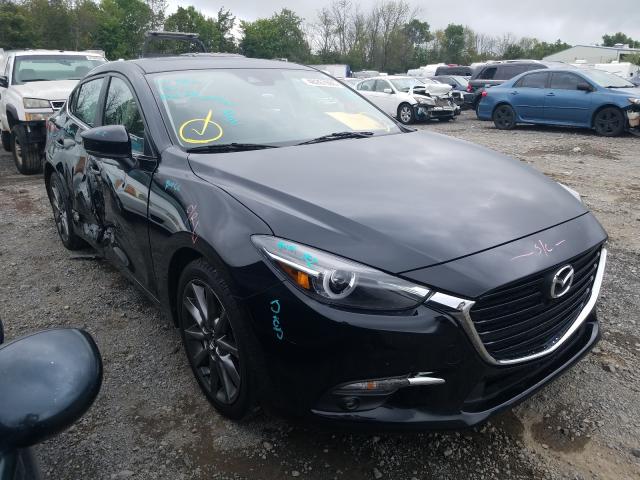 2018 mazda 3 grand to