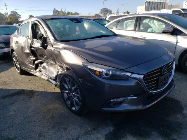 2018 mazda 3 grand to